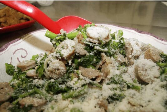 Sauteed mushrooms and greens with grated cheese