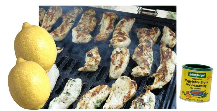 Seasoned fish fillets beside lemon and broth