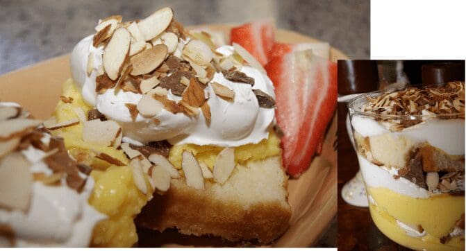 Lemon custard cake with whipped cream and almonds
