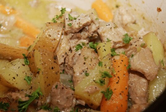 Hearty meat and vegetable stew with parsley