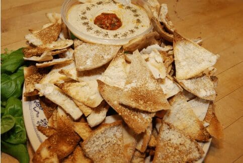 Toasted pita chips with hummus dip