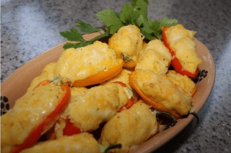 Cheesy stuffed mini peppers on platter