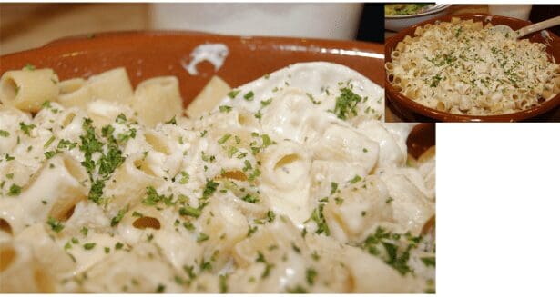 Creamy rigatoni Alfredo with parsley garnish