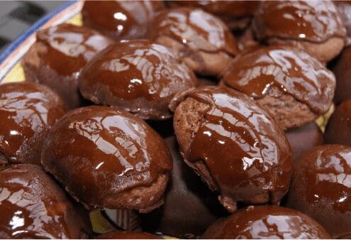 Bite-size chocolate-glazed cookies on plate
