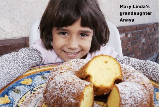 Smiling child with sliced bundt cake