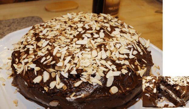 Chocolate cake topped with sliced almonds