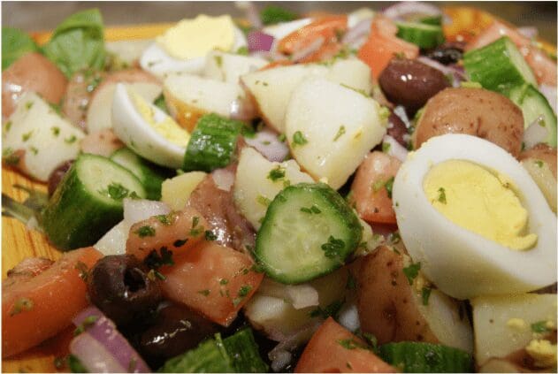 Potato salad with hard-boiled eggs and cucumbers