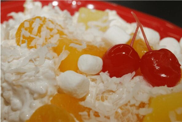 Whipped cream fruit salad with cherries