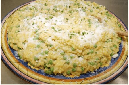Creamy parmesan pea risotto on colorful plate