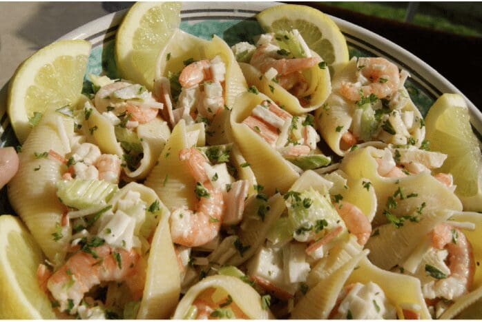 Shrimp-stuffed pasta shells garnished with lemon