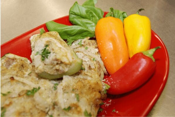 Herb-crusted chicken with colorful mini peppers