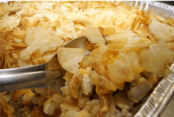 Potato chip-topped casserole in aluminum tray